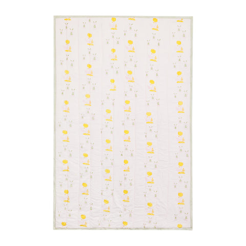Single bed cotton quilt with repeating bunny and tree block print motifs on a light pink base, handcrafted for everyday comfort