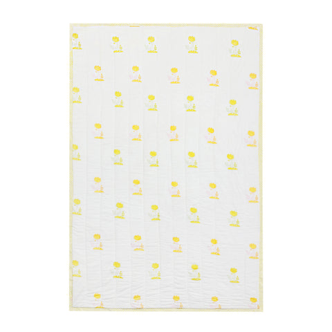 Back side of a reversible cotton quilt showing coordinated bunny garden patterns in light multicolour tones on breathable cotton fabric