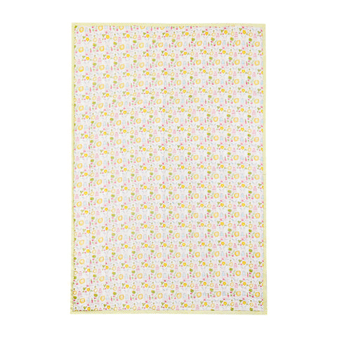 Full view of a 60x90 reversible cotton quilt featuring bunny garden motifs on a white base with soft multicolour detailing