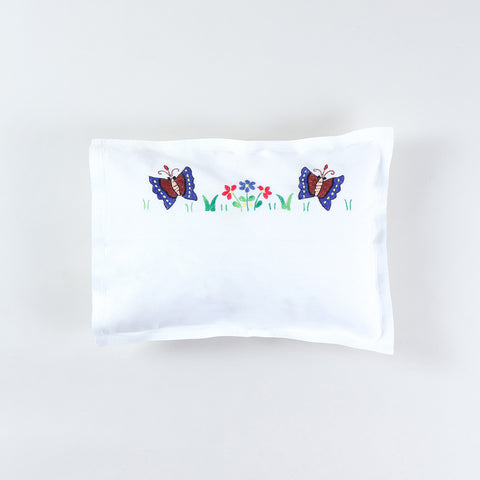 Kids pillow cover with colourful butterfly and floral hand embroidery on a white cotton base from the handmade kids bedding collection