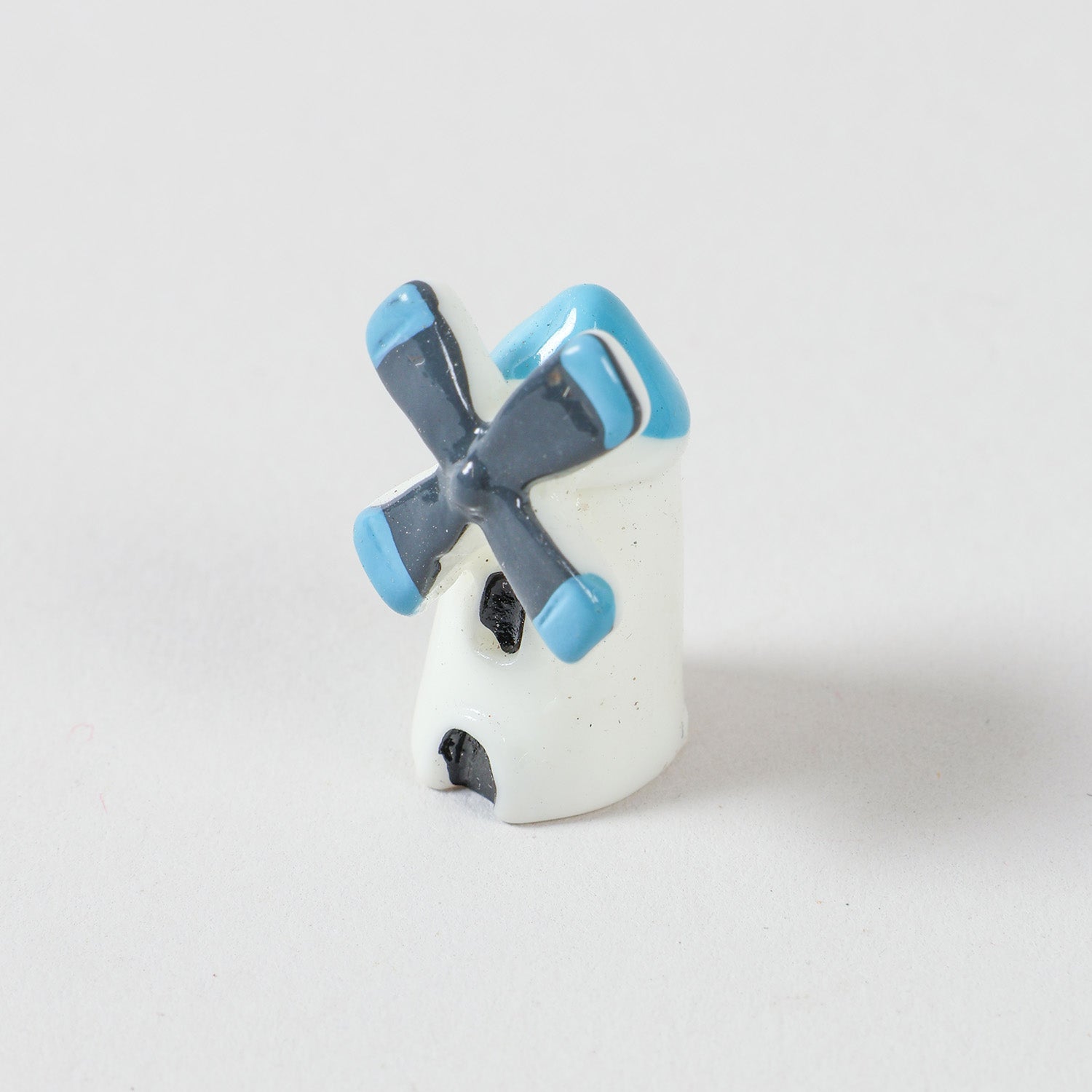 Ceramic windmill miniature with colourful handpainted details, perfect for miniature garden decorations, fairy gardens, and indoor planter decor