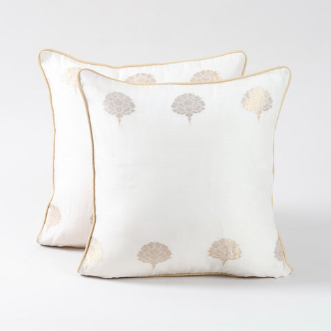 Set of two off-white Chanderi cushion covers featuring woven tree motifs and a soft lustrous finish