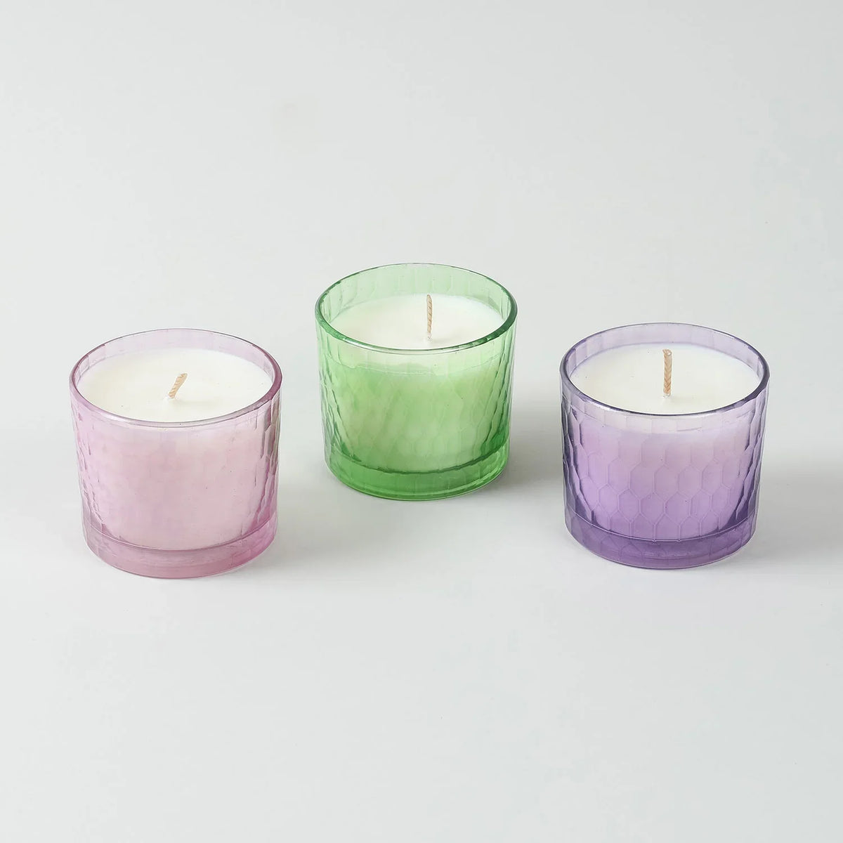Set of three chiseled glass soy wax scented candles in Green Apple Rose and Lavender fragrances