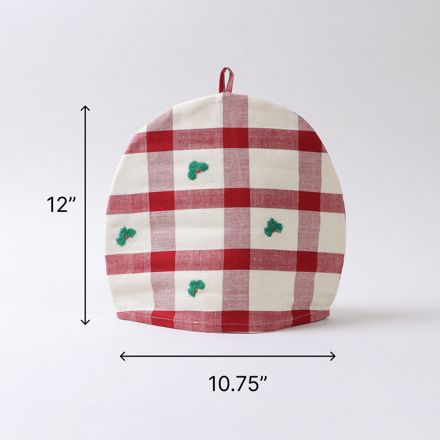 Size chart of a cotton tea cozy measuring 10.75 inches x 12 inches, designed to keep tea and coffee warm