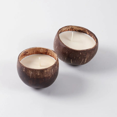 Angled view of an eco-friendly coconut shell soy wax candles with rustic handcrafted appeal