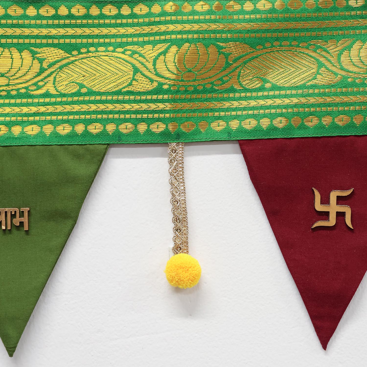Close-up of the colourful fabric panels of The Colour Box festive toran
