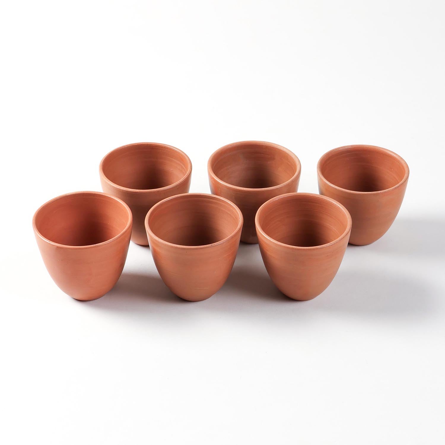 Conical terracotta kulhad cups set of 6, handmade clay tea cups for chai, coffee, and everyday use.