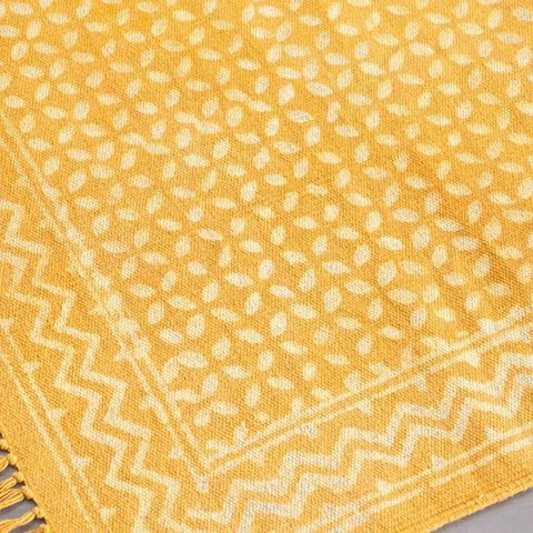 Handwoven details of mustard coloured handloom dhurrie with geometric block printed for hallway, bedside, and entryway decor