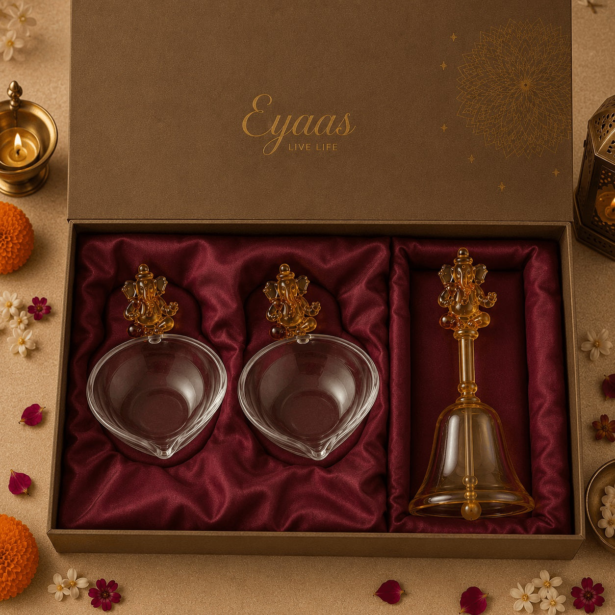 Divine glass Ganesh diya and bell gift set styled in a festive gifting setting