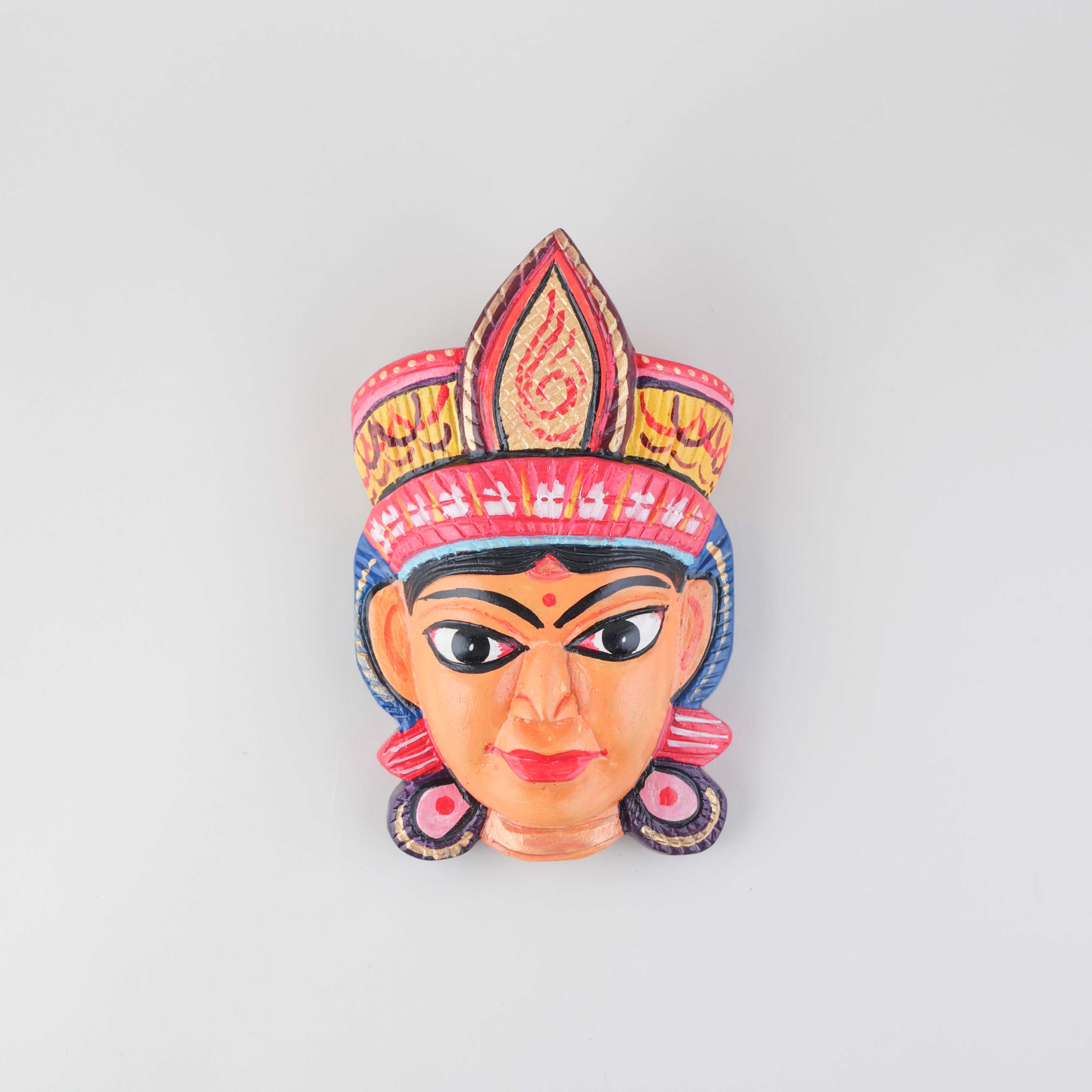 Handpainted Durga Gomira wooden mask featuring vibrant colours and intricate hand-carved details, displayed on a plain background