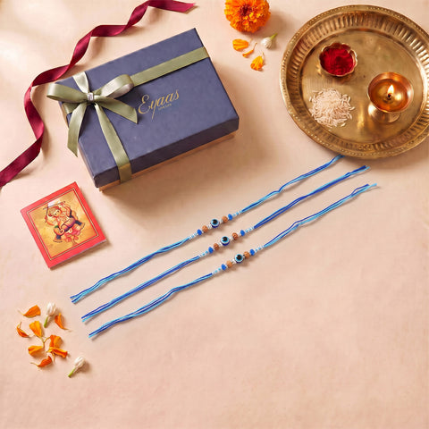 Handmade Evil Eye Rakhi with Decorative Beads for Brothers, Set of 3, beautifully presented in a festive gift box for Raksha Bandhan gifting.