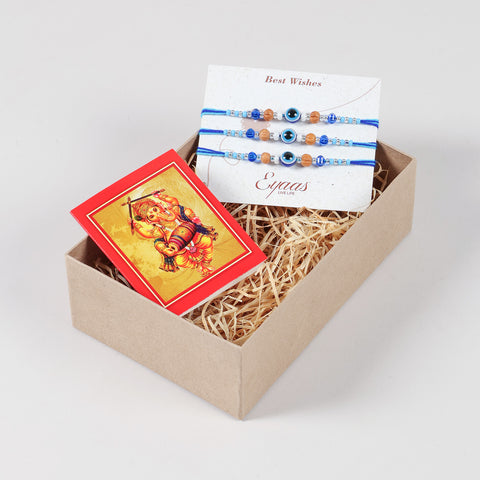 Handmade Evil Eye Rakhi with Beads, Set of 3, neatly arranged inside a decorative Raksha Bandhan gift box