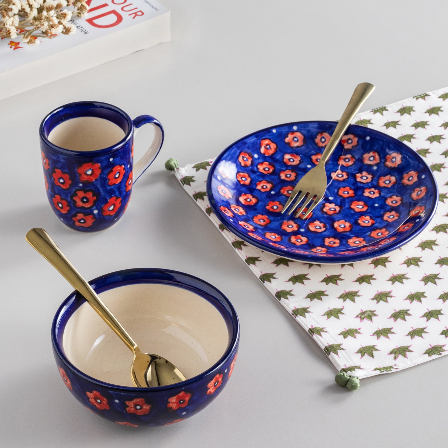 Handpainted floral ceramic breakfast set featuring a mug, bowl, and breakfast plate in blue and red colours, perfect for table setting and dinnerware