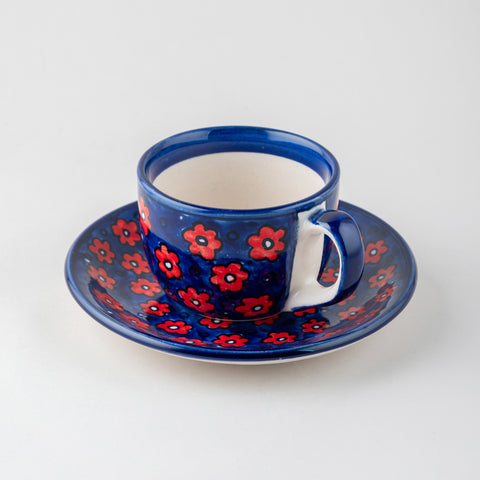 Floral ceramic mug and saucer set handcrafted in Khurja, featuring coordinated hand painted motifs on a plain background