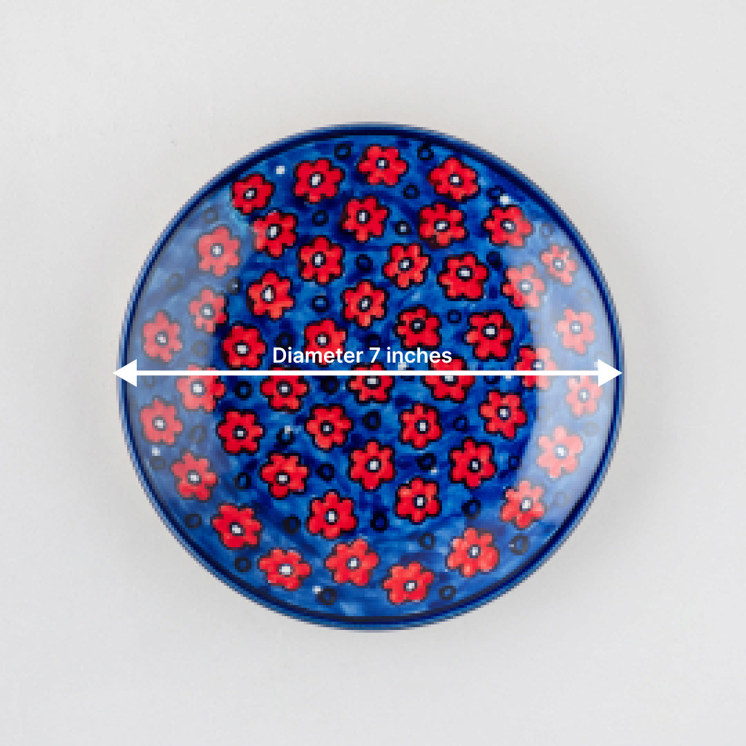 Size chart of floral ceramic saucer showing a diameter of 7 inches
