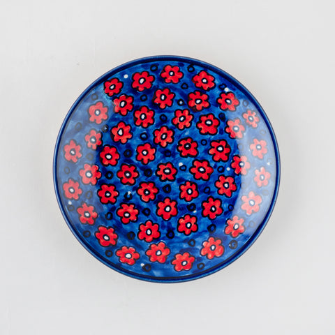 Floral ceramic saucer handcrafted in Khurja with hand painted detailing, designed to complement matching mugs and cups
