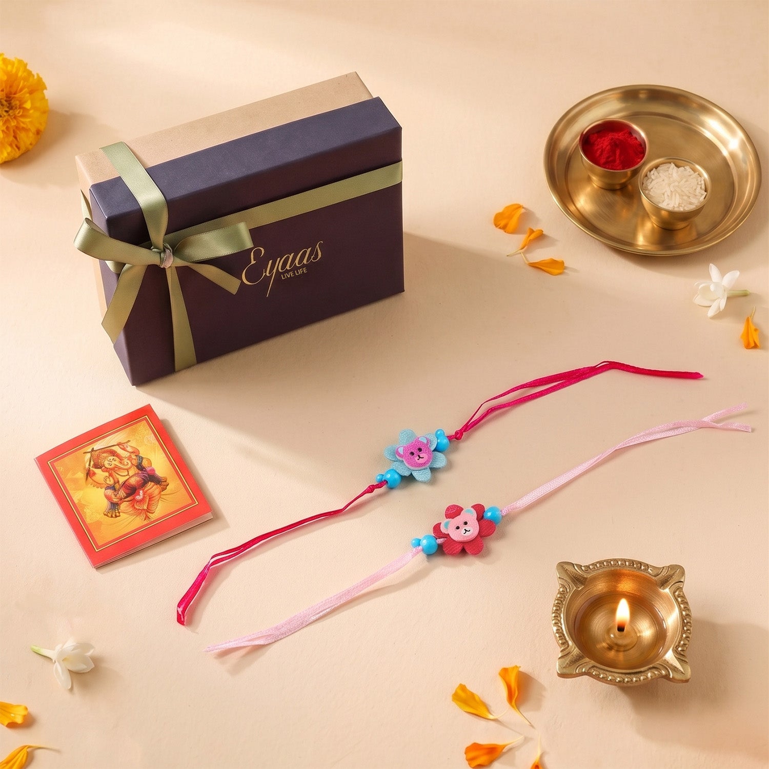 Floral Ribbon Wooden Teddy Bear Kids Rakhi Set of 2 with pink and blue satin ribbon flowers, presented in a gift box, ready for Raksha Bandhan gifting