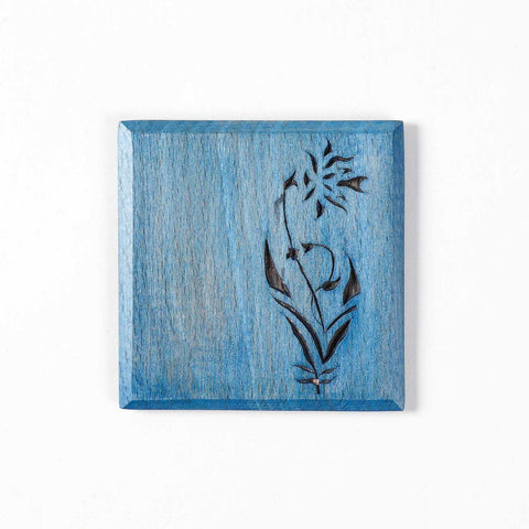 Top view of Floral Vine hand-carved wooden table coasters with multicolour artwork