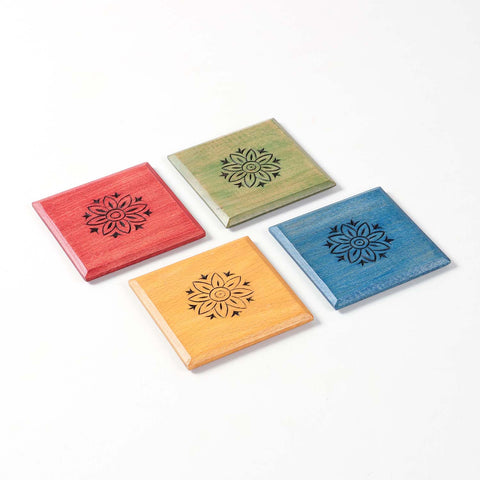Angled view of the Floral wooden coaster set of 4 showcasing the colourful handcrafted floral artwork.