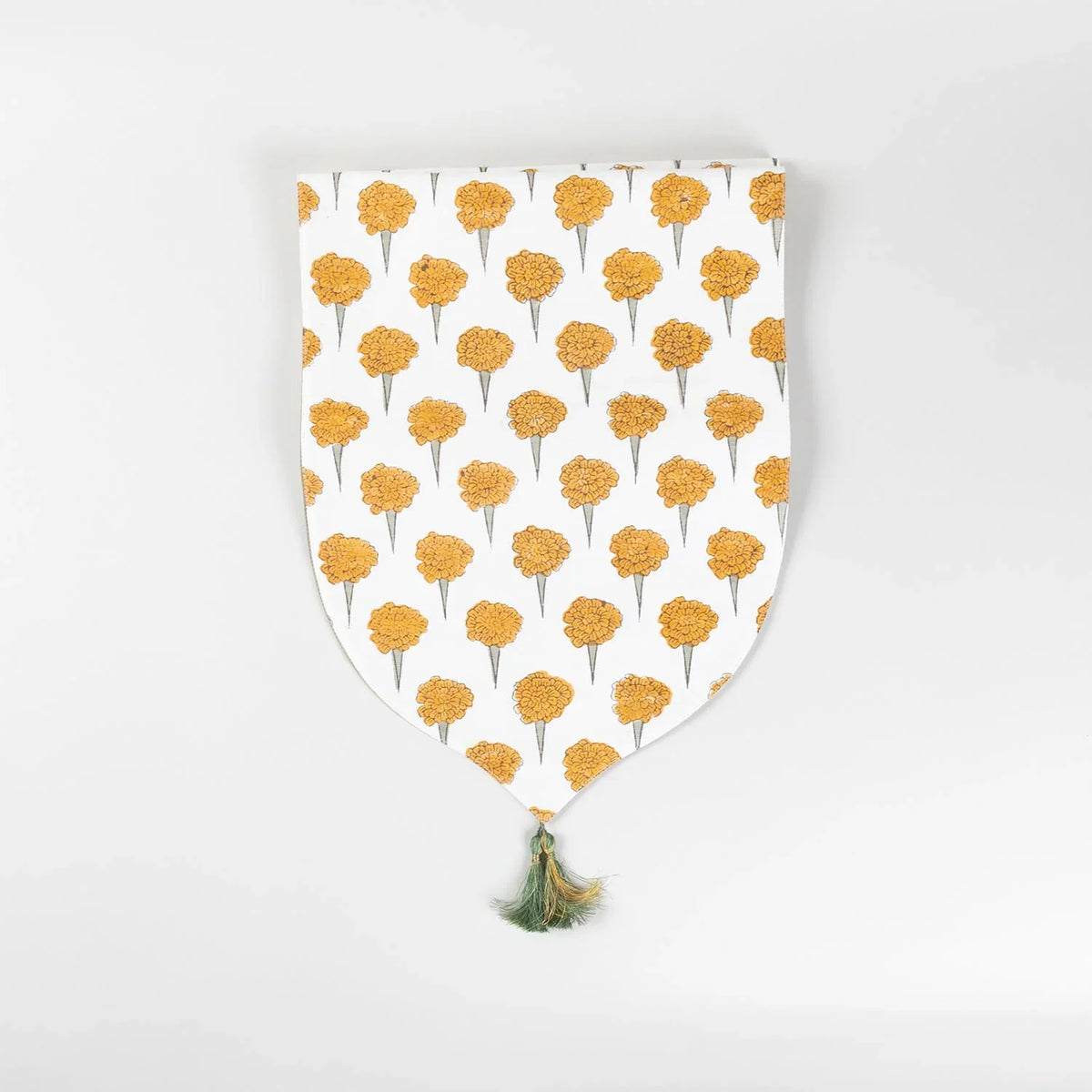 Folded view of marigold Buta block printed Chanderi table runner measuring 13 x 60 inches for a 4-seater dining table