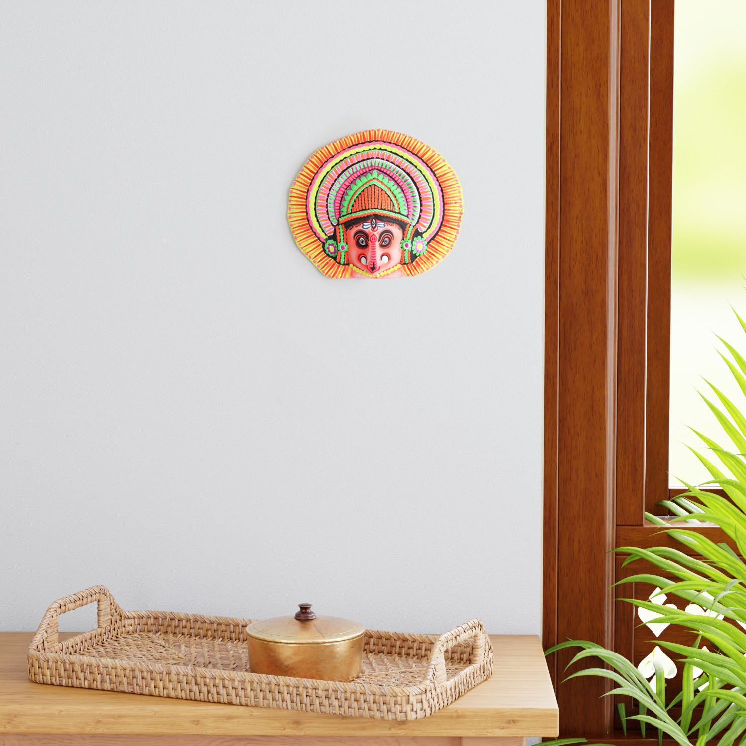Handmade Ganesha Chhau wall mask displayed as living room wall decor, showcasing vibrant colours and traditional Indian folk art craftsmanship
