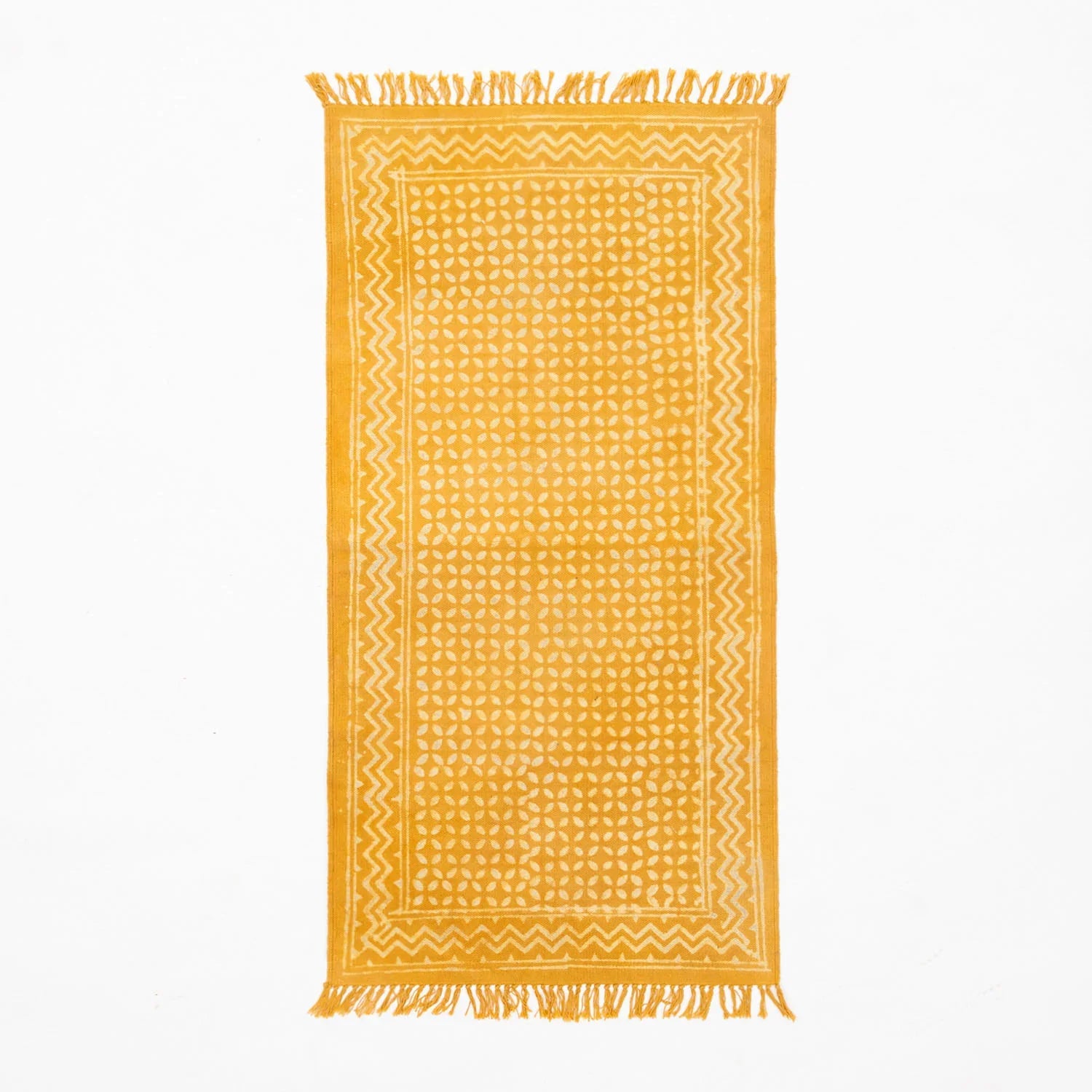 Handwoven floor runner with geometric motifs and fringe detailing