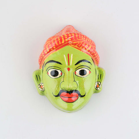 Hand-painted green Cheriyal male mask crafted from papier-mache, showcasing traditional Telangana folk art details on a plain background