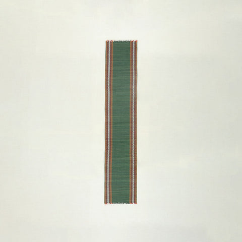 Full-length handmade green Madhurkathi table runner crafted from natural river grass, ideal for dining table decor and table settings