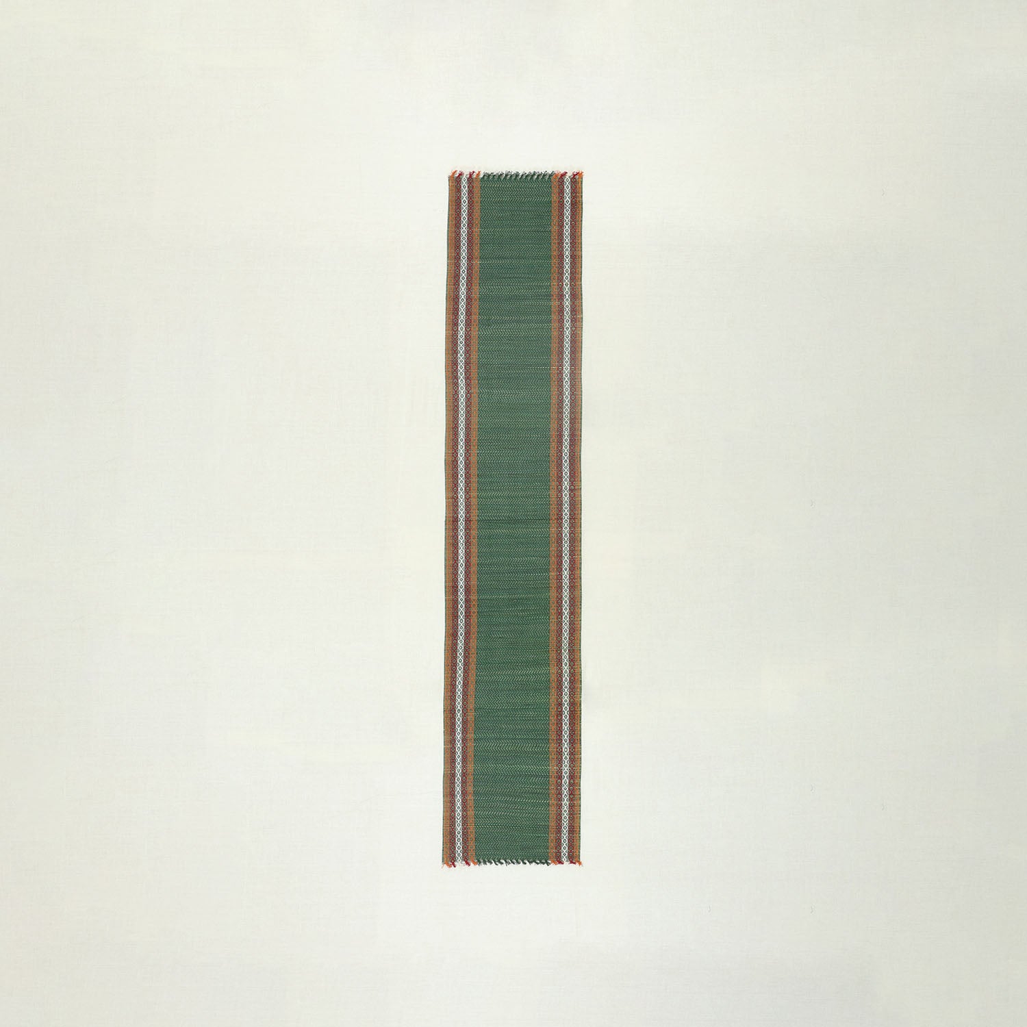 Full-length handmade green Madurkathi table runner crafted from natural river grass, ideal for dining table decor and table settings