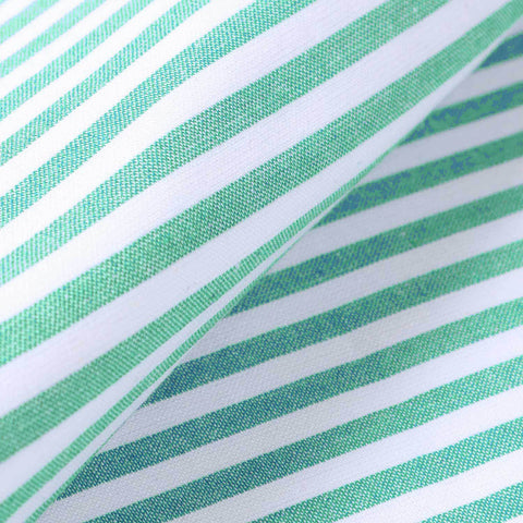 Detailed view of cotton placemat fabric with green stripe design showcasing durable handcrafted construction