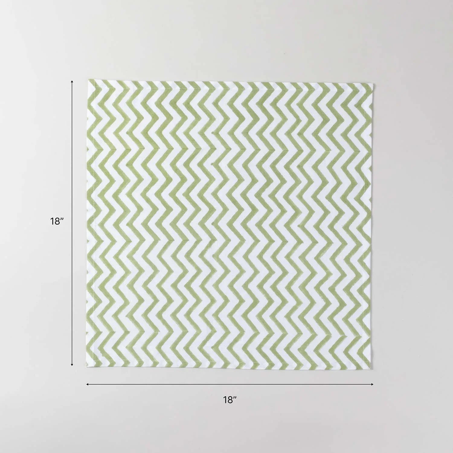 18 x 18 inch cotton dinner napkin size guide featuring green zigzag block printed design