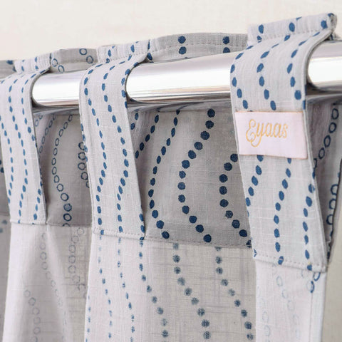Grey Hand block-printed tab-top cotton curtains for easy hanging and elegant window styling.