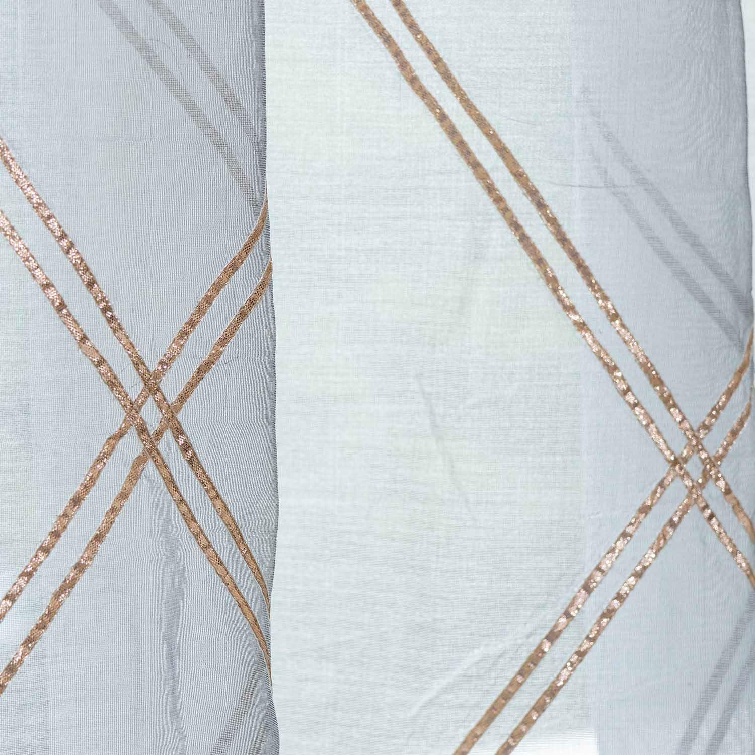 Close-up of grey handloom Chanderi cotton silk fabric showing sheer texture and subtle sheen