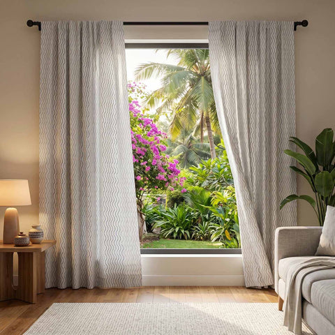 Hand block-printed grey cotton curtain with blue wave lines for the living room, adding a soft, natural look to the space.