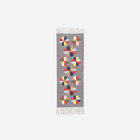 Full size 1x3 ft cotton rug with multicoloured geometric floral motifs woven on a soft grey base