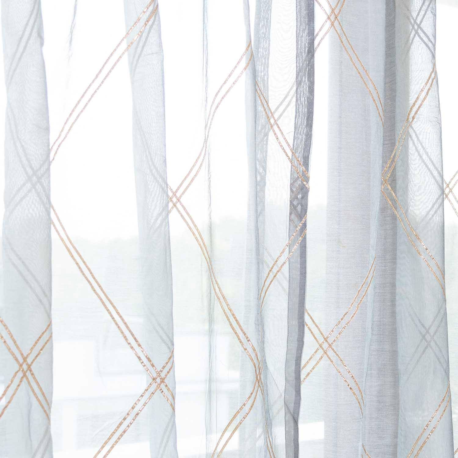 Grey Chanderi sheer curtain gently filtering sunlight to create a soft and airy ambience
