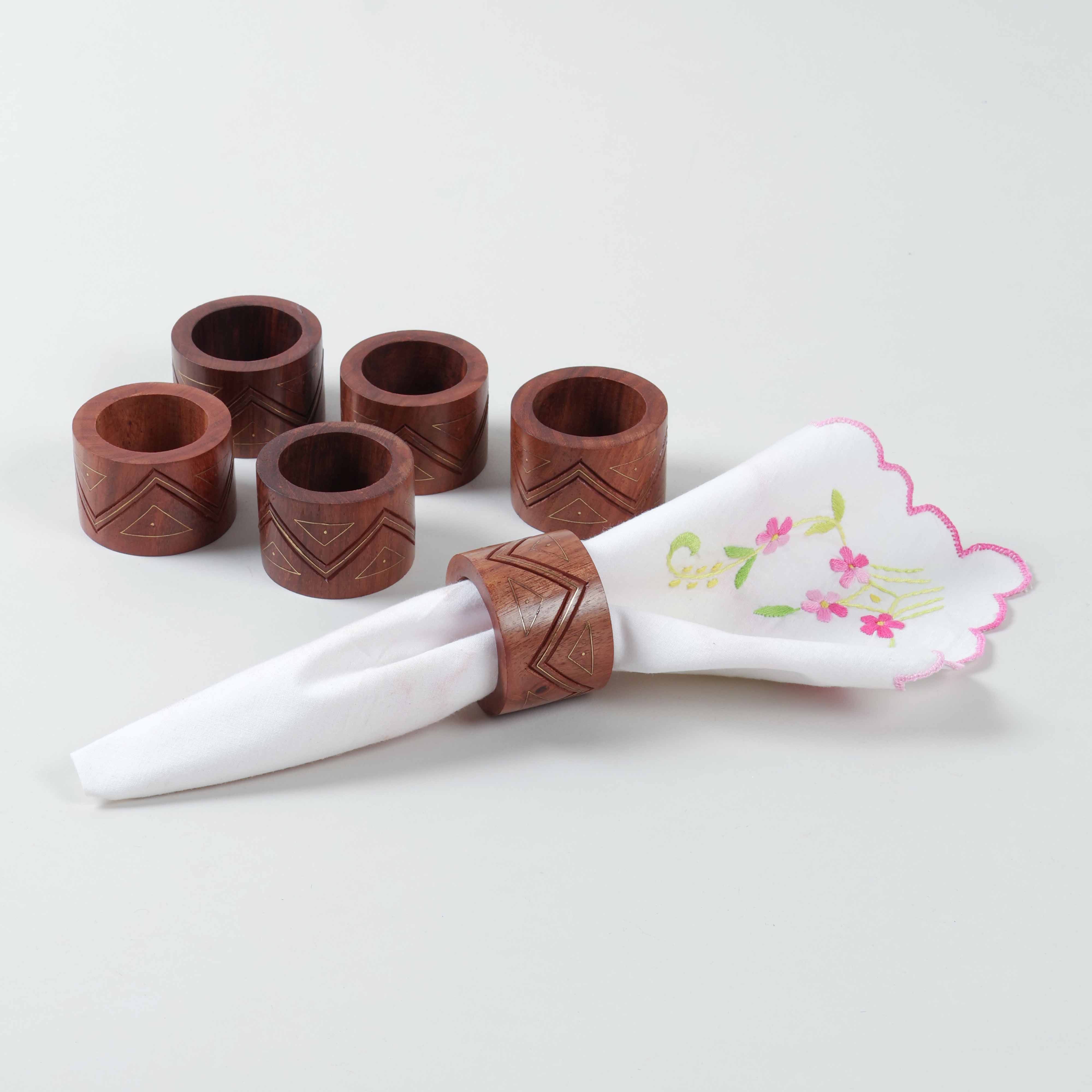 Handcrafted wooden napkin ring sstyled with a cloth napkin for sophisticated table decor and dining presentation