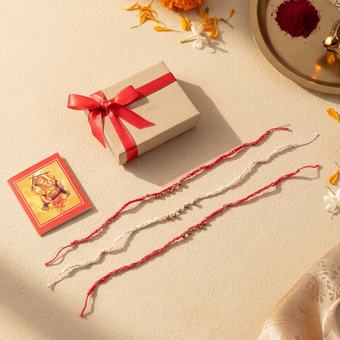 Handmade Crochet Brass Bead Thread Rakhi, beautifully presented in a festive gift box with ribbon, ready for Raksha Bandhan gifting.