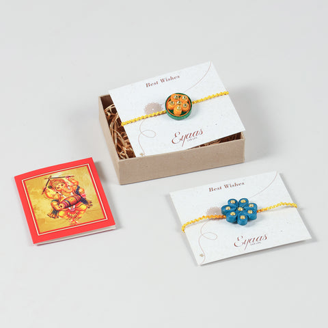 Handmade Floral Paper Quilled Rakhi neatly arranged inside a festive gift box, ready to gift your brother.
