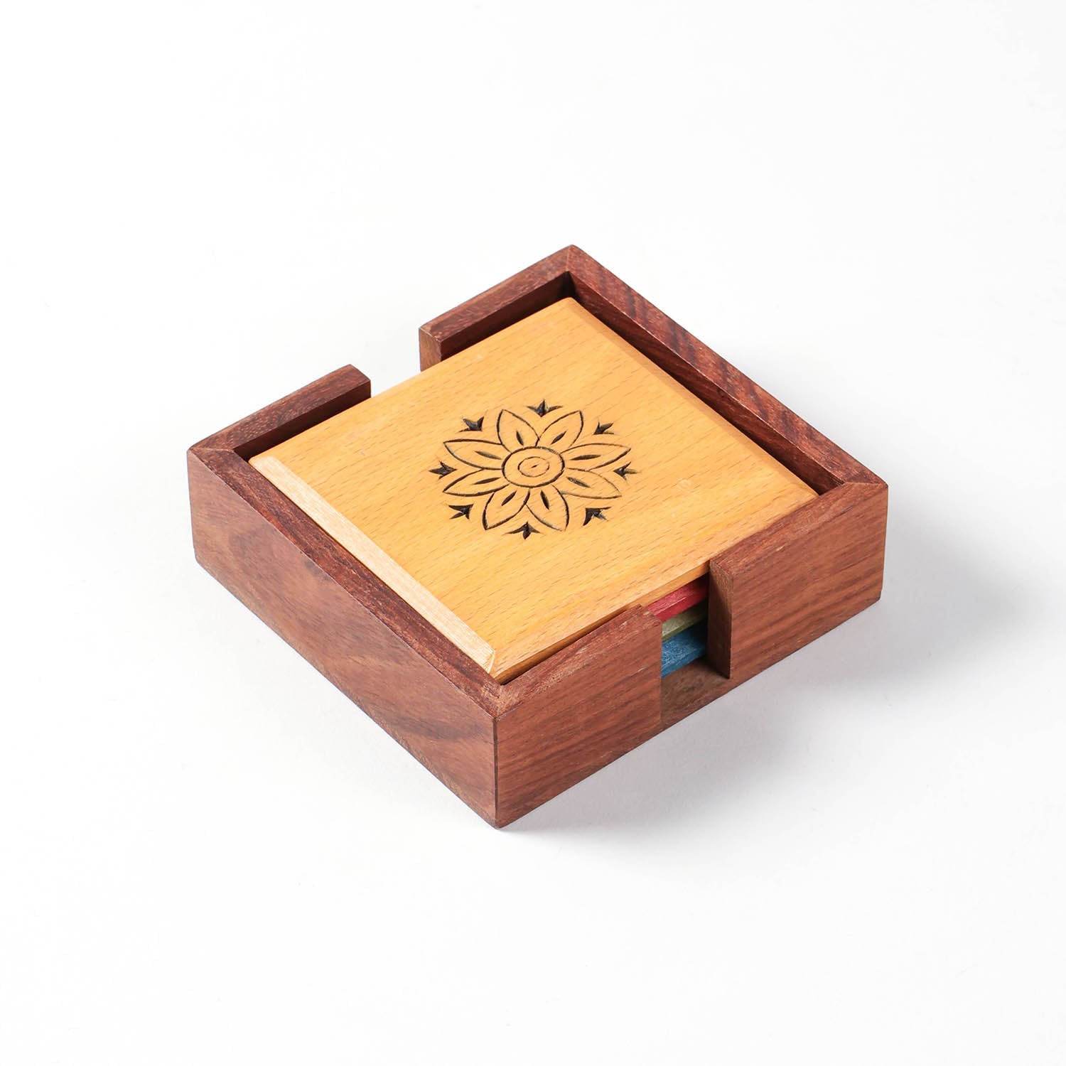 Handmade floral wooden coaster set crafted in India for stylish table protection.