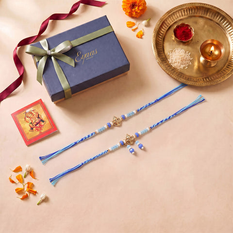 Handmade Ganesh Rakhi & Lumba Set with Blue Beads for Bhaiya Bhabhi, beautifully presented in a festive gift box for Raksha Bandhan gifting.
