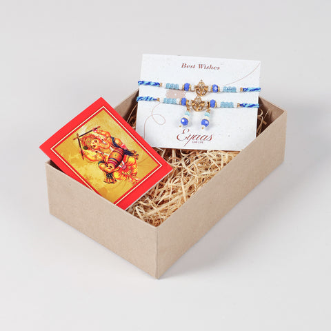 Handmade Ganesh Rakhi & Lumba Set with Blue Beads neatly arranged inside a decorative Raksha Bandhan gift box