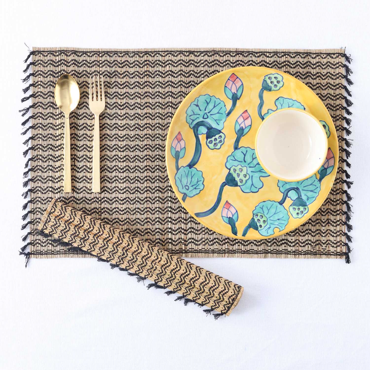 Flat lay of  handmade Madurkathi dining table placemats, and dining accessories showcasing eco-friendly dining table mats