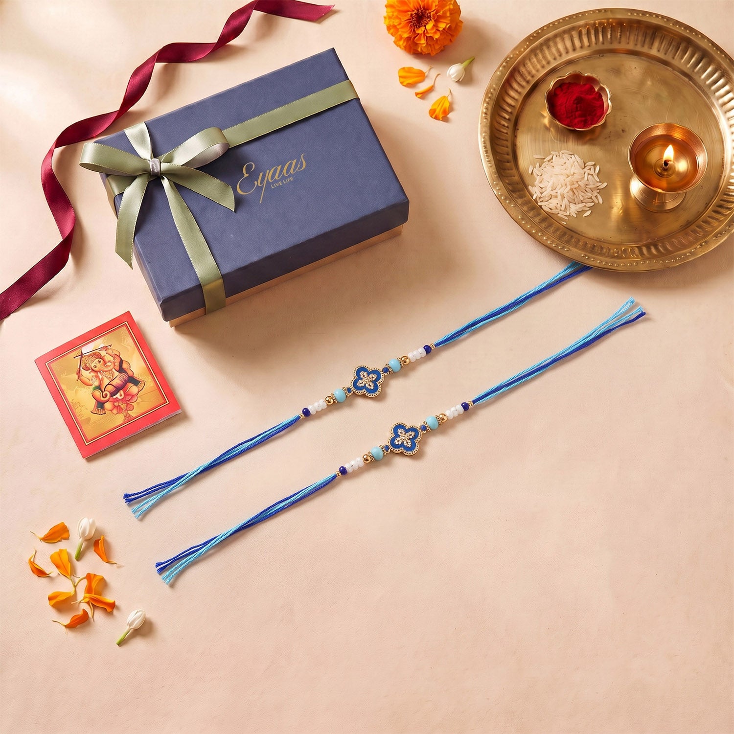 Handmade Metal Floral Rakhi for Brothers (Set of 2), beautifully presented in a festive gift box, ready for Raksha Bandhan gifting.