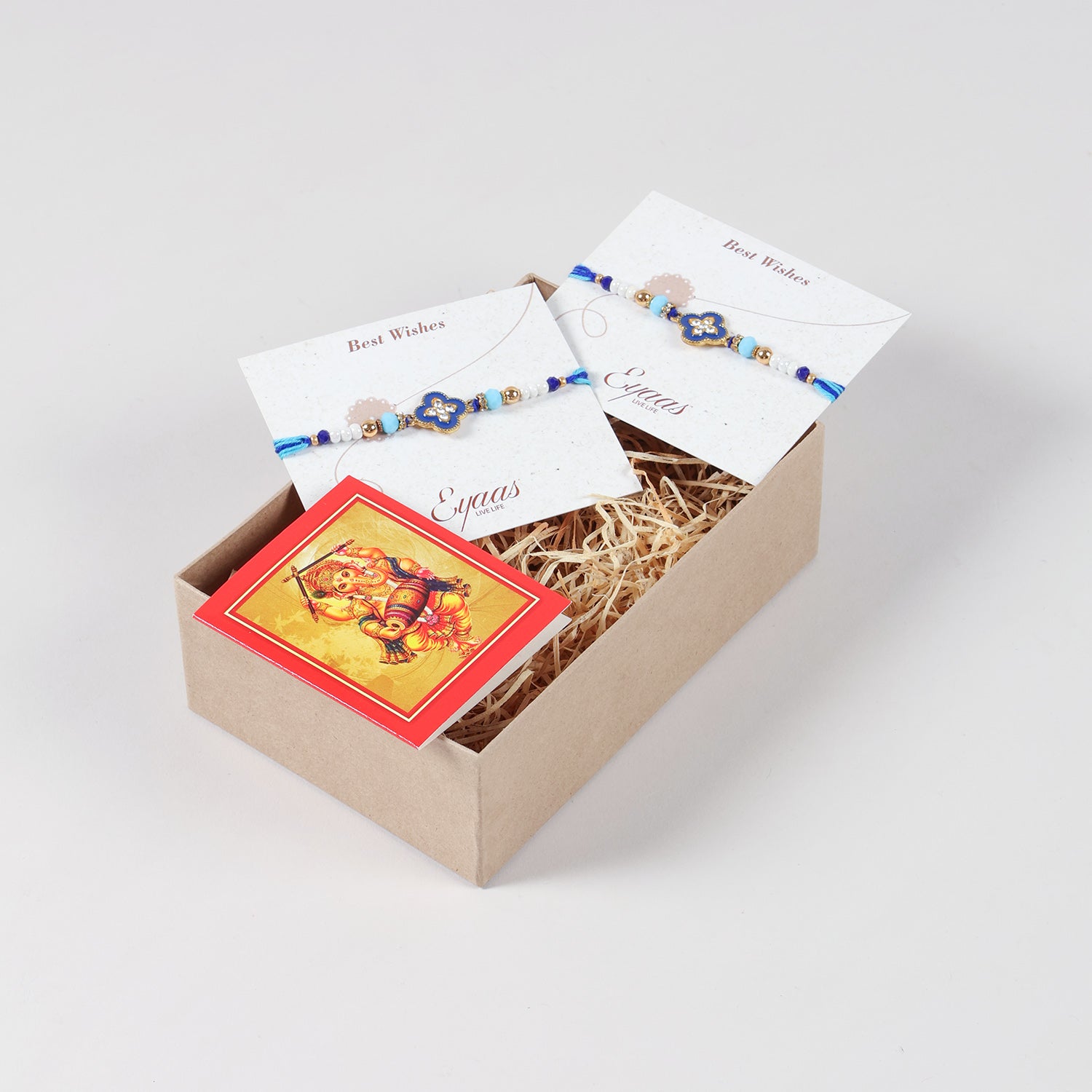 Handmade Metal Floral Rakhi for Brothers (Set of 2), carefully arranged inside a festive Raksha Bandhan gift box