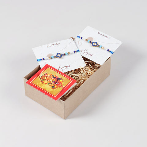 Handmade Metal Floral Rakhi for Brothers (Set of 2), carefully arranged inside a festive Raksha Bandhan gift box