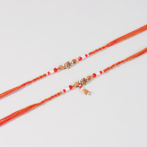 Close-up of the Handmade Om Rakhi & Lumba Set featuring the Om charm, handcrafted beadwork, and traditional thread detailing.