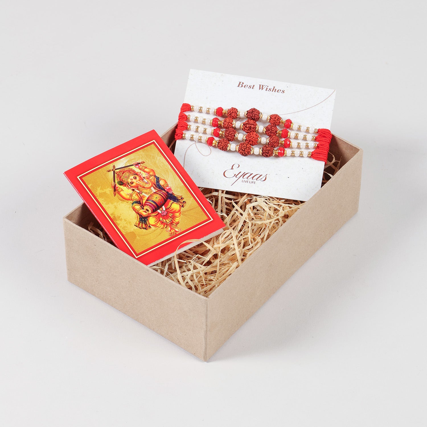 Handmade Rudraksha Rakhi Set of 4 neatly arranged inside a decorative Raksha Bandhan gift box