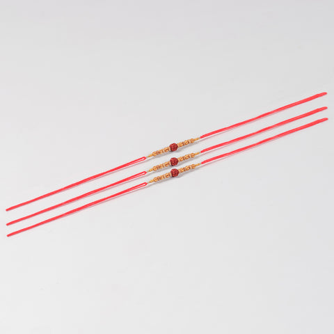 Full-length view of the Handmade Rudraksha & Wooden Bead Rakhi Set of 3 with handcrafted beadwork and Mauli red thread.