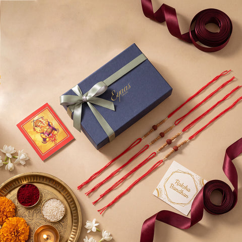 Handmade Rudraksha & Wooden Bead Rakhi Set of 4, beautifully presented in a festive gift box for Raksha Bandhan gifting